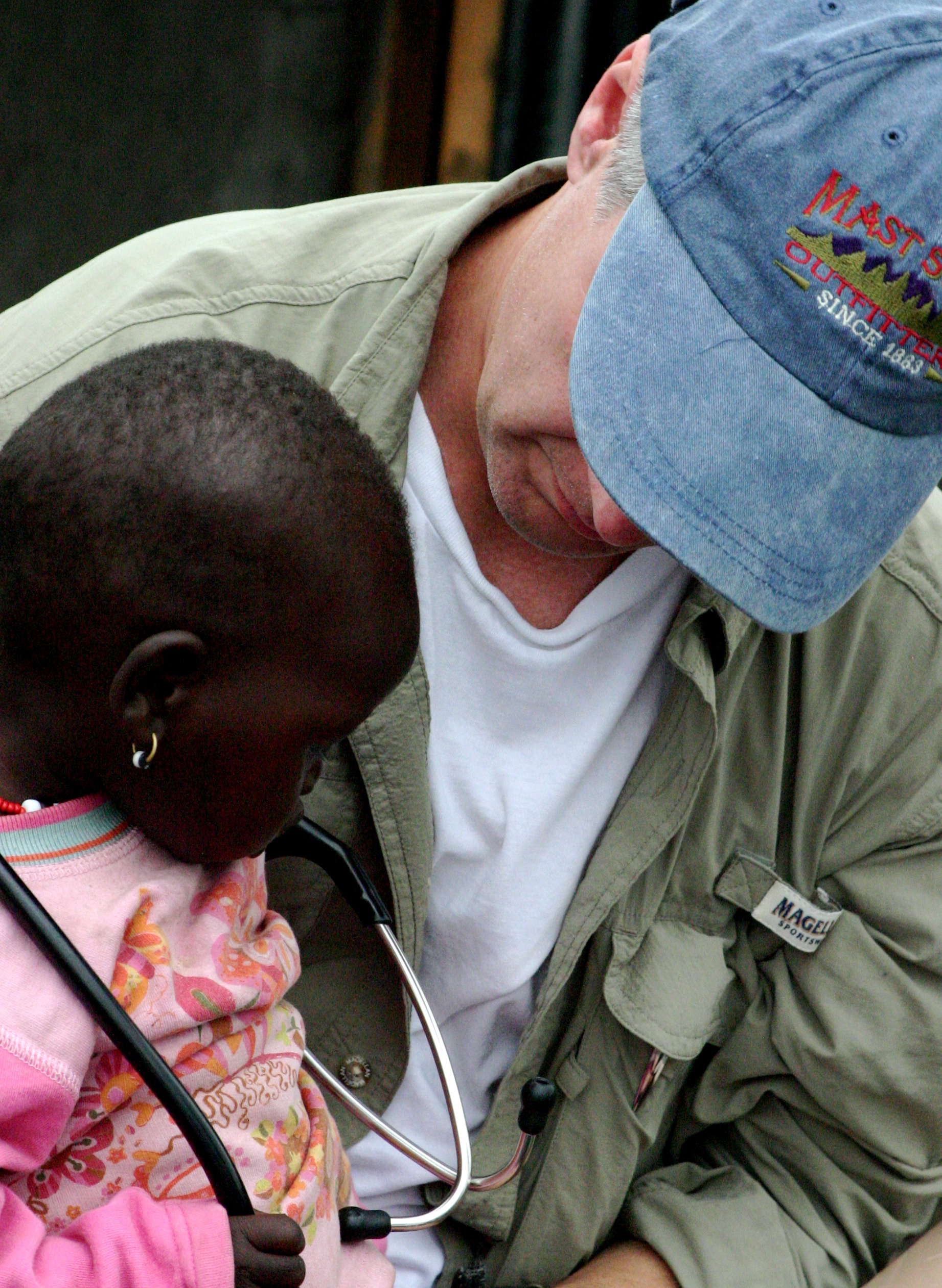Healthcare volunteer providing medical care to a child