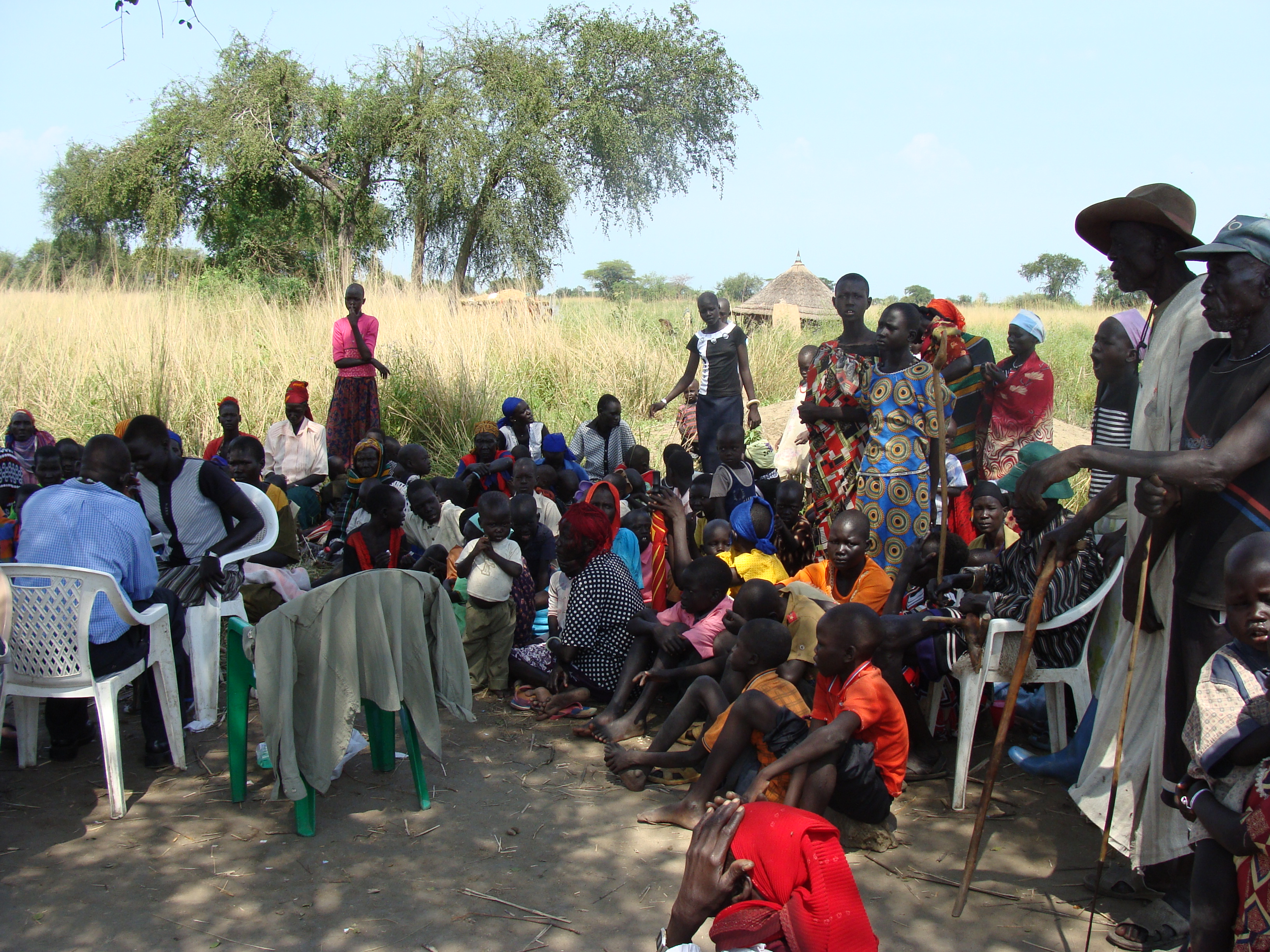 Large outdoor community gathering during a mission outreach