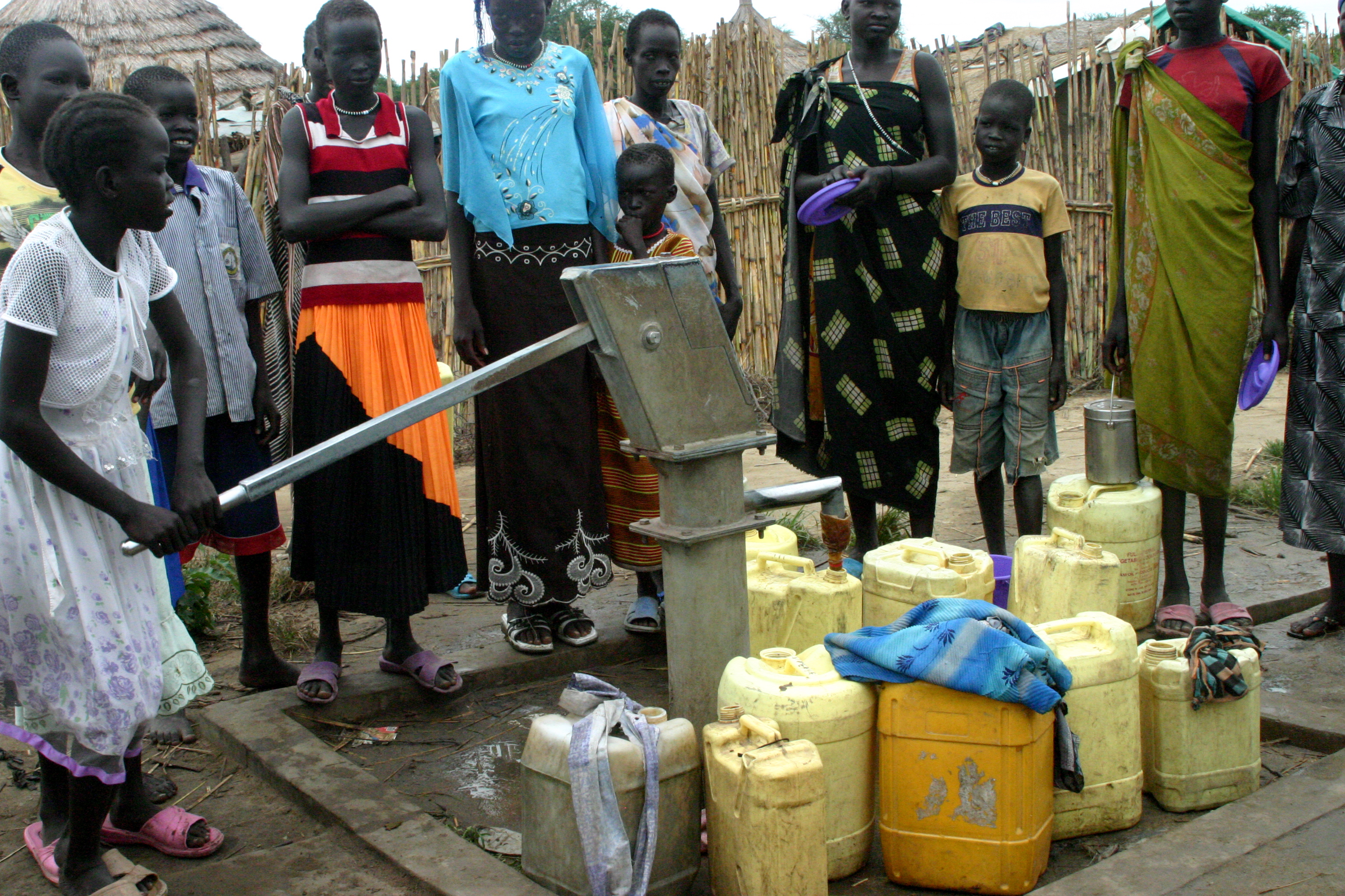 Community accessing clean water from the well