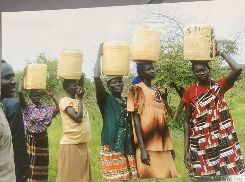 Clean water flowing from a Y.E.T. Compassion well in Biong
